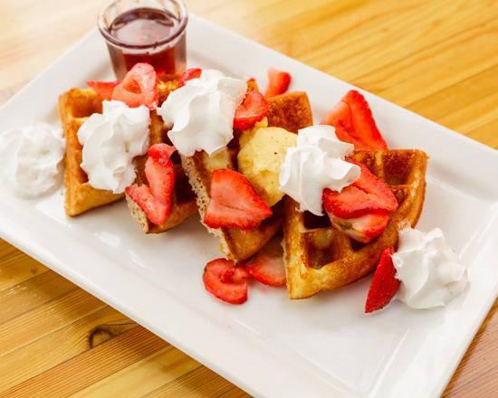Waffles (gluten free) · Waffles made from house made batter served with honey butter and syrup on the side.