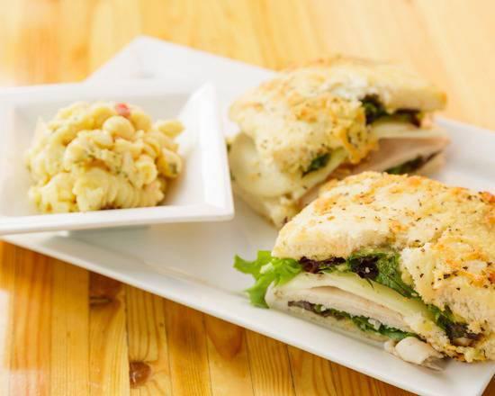 Turkey Pesto · Turkey, roma tomatoes, provolone, roasted walnuts, pesto dressing and spring mix on fresh baked focaccia serve with chips