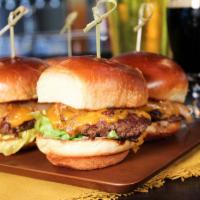 Beef Sliders · Beef sliders, cheddar cheese, lettuce, tomato, garlic aioli, secret sauce, grilled onion and...