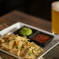 Chips & Guacamole · Corn tortilla chips topped with fresh cilantro, sides of guacamole & roasted tomato salsa. M...