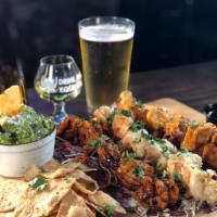Shrimp Trio · 18 Prawns smothered in 3 of our favorite sauces: 6 Craft Beer-Battered, 6 Garlic-Butter, and...