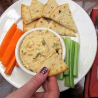 Hummus of the Day (vegetarian) · Chef’s choice of flavored hummus. Served with baked pita chips and vegetable sticks.