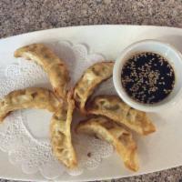 Gyoza · Fried dumplings filed with pork or vegetable served with sweet sesame soy sauce.