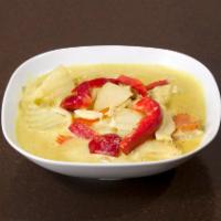 32. Yellow Curry · Potato, carrot, bell pepper and onion in coconut curry with a touch of curry powder and serv...