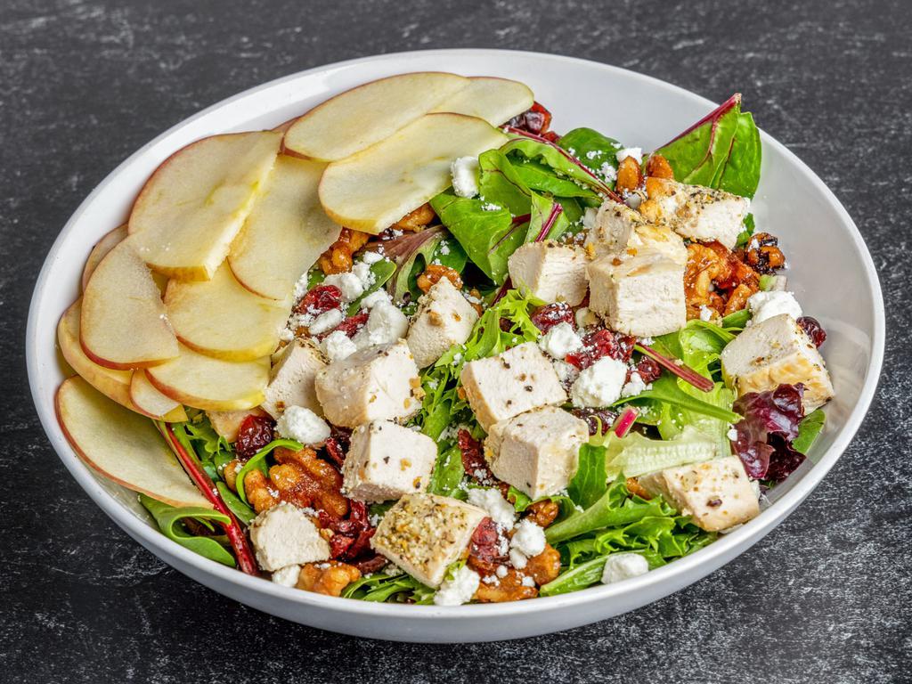 Harvest Chicken Salad · Oven roasted chicken, mixed greens, candied walnuts, cranberries, crisp apple and feta cheese crumbles with our house made champagne vinaigrette.