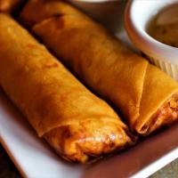 A3 Crispy Eggrolls · 2 pieces. Fried rolls stuffed with bead thread noodle, green cabbage, carrot, celery mixed i...