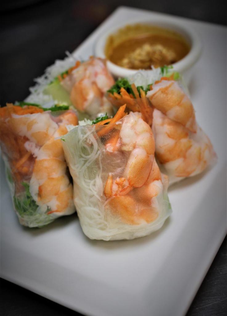 A4. Summer Rolls · 2 pieces. Rice paper rolled with choice of shrimp or tofu, green leaves lettuce, vermicelli rice noodle, and carrots, cucumber. Served with peanut sauce.