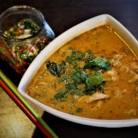 T1. Tom Yum Seafood · Shrimp, squid, mushrooms in lime juice, lemongrass galangal, Kaffir lime leaves, and Thai ch...