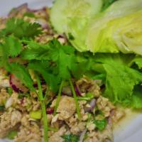 S3. Larb Salad · Choice of ground meat. Shallots, cilantro, scallions, chili powder, rice powder, and lime ju...