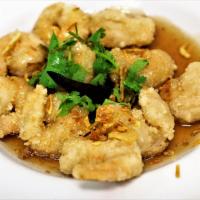 CS3. Crispy Shrimp in Tamarind Sauce · Light battered fried shrimp topped with tamarind sauce. Garnished with cilantro, dry chili, ...