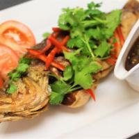 CS4. Fried Whole Fish · Deep fried bass with choice of either Thai chili sauce or Curry sauce. Served with white rice.
