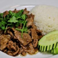 R6. Pad Kra Tiam Prik Thai · Garlic stir-fry with choice of meat; black pepper in special soy sauce. Topped with cilantro...