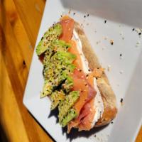 Salmon Toast · Handcrafted Artisan Sourdough Bread, Smoked Salmon, Cream Cheese, and Avocado. Topped off wi...