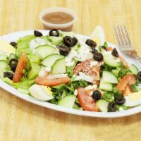 Baba's Signature Salad · Cucumber, tomato, onions, olives, boiled egg, feta cheese. Tossed with 100% virgin olive oil.