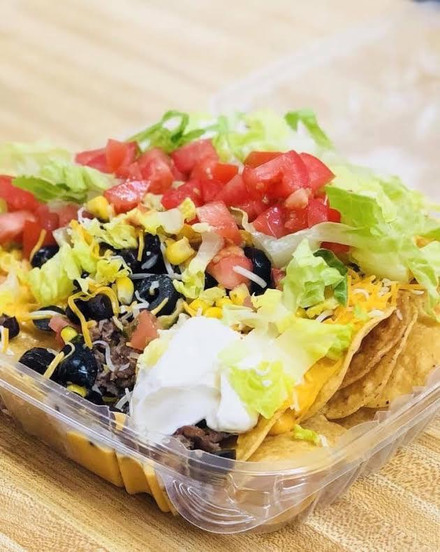 Ground Beef Nacho and Cheese · Add your choice of toppings and sauces to the corn chips!