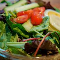Waldy's House Salad · Mixed greens, grape tomatoes, mixed olives, red onions, cucumbers and herb vinaigrette.