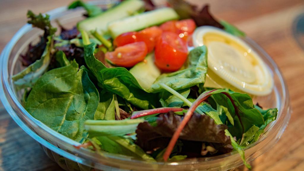 Waldy's House Salad · Mixed greens, grape tomatoes, mixed olives, red onions, cucumbers and herb vinaigrette.