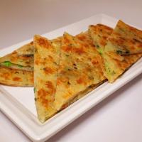 Green Onion Pancake · Also known as a scallion pancake, is a Chinese, savory, unleavened flatbread folded with oil...