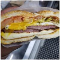 Hungry Monkey Sandwich · Salami, over and easy egg, fried cheese, American cheese, lettuce and tomato.