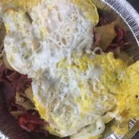 Corned Beef Hash · Diced potatoes, roasted red peppers, fried onions, chopped and grilled corned beef with 2 fr...