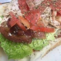 Sinatra Sandwich · Sun-dried tomato pesto, grilled turkey, bacon, romaine and tomatoes.