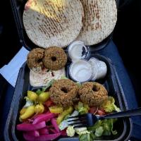 Falafel Plate · Includes pita bread, lettuce, tomatoes, pickled turnips, pepperoncini, hummus, and tahini sa...
