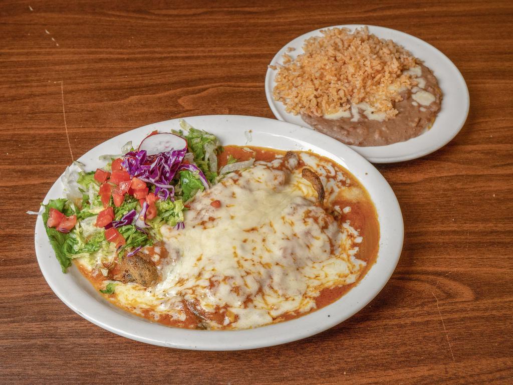 Chile Relleno Platter · Egg battered Anaheim pepper stuffed with Monterey cheese and simmered in our delicious sauce served with rice, refried beans and a homemade flour tortilla.