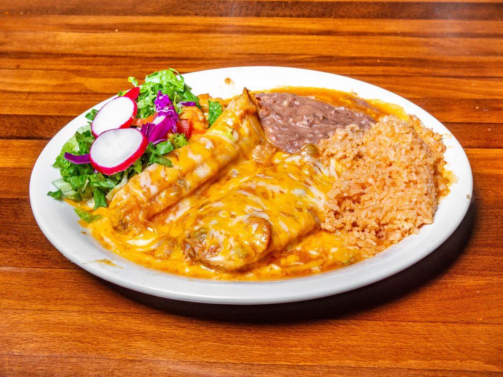 Tamales Plate · 2 pork, chicken or rajas con queso homemade tamales served with rice and refried beans.