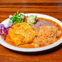 Chimichanga Platter · Wrapped flour tortilla deep-fried to crispy golden brown served with rice and beans along wi...