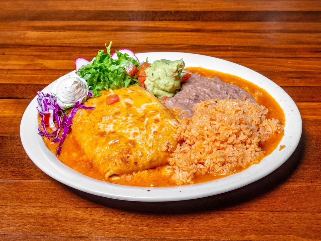 Chimichanga Platter · Wrapped flour tortilla deep-fried to crispy golden brown served with rice and beans along with sour cream and guacamole.