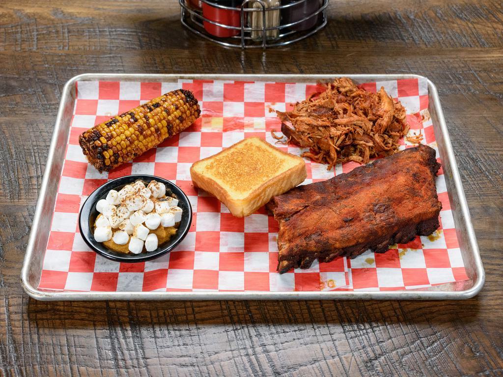 Big Baller Combo  · 1/2 rack of our tender fall of the bone ribs with dinner portion choice of chicken, pork or 5 piece smoked wings. Served with 2 sides and Texas toast.