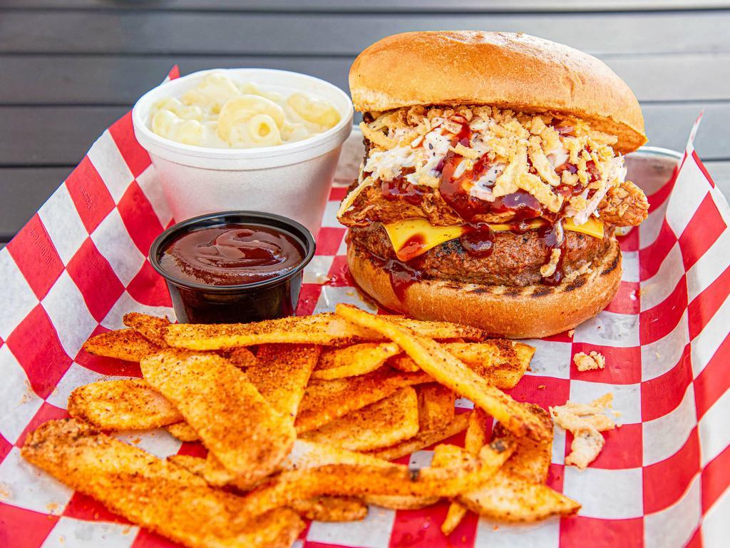 Big BBQ Burger On a Bun · 1/2 lb. patty with smoked and shredded pork topped with  BBQ, slaw and onions. Served with choice of 1 side and choice of bun or Texas toast.