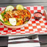 Crispy Chicken Salad · A large fresh bowl of mixed greens, tomatoes, cucumbers, onions, cheddar cheese, egg and cru...