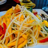 Grilled Shrimp with Mango Salad · Grill shrimp with mango, raw papaya, cilantro, red bell pepper and crunch peanut with thai s...