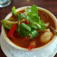 9. Tom Yum Koong Soup · Hot and sour shrimp soup with lemongrass, lime juice, mushrooms, bell peppers, onions, scall...