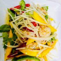 Grilled Shrimp with Mango Salad · grill shrimp with mango, raw papaya, cliantro, red pepper, peanut crunch and spicy thai vina...