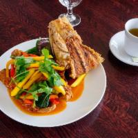 Mango Snapper · Fried Whole red snapper topped with sweet and sour mango sauce with mango, bell pepper and T...