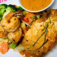 Special Seafood · Grilled fillet of salmon and jumbo shrimp served with broccoli, red peppers, carrots, peas, ...