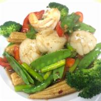 Seafood Combination · Sauteed shrimp and scallops with red bell peppers, asparagus, baby corn, snow peas and garli...