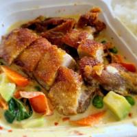 Duck With Avocado Green Curry · Half crispy boneless duck on green curry with avocado, carrot, bell peppers, green peas and ...