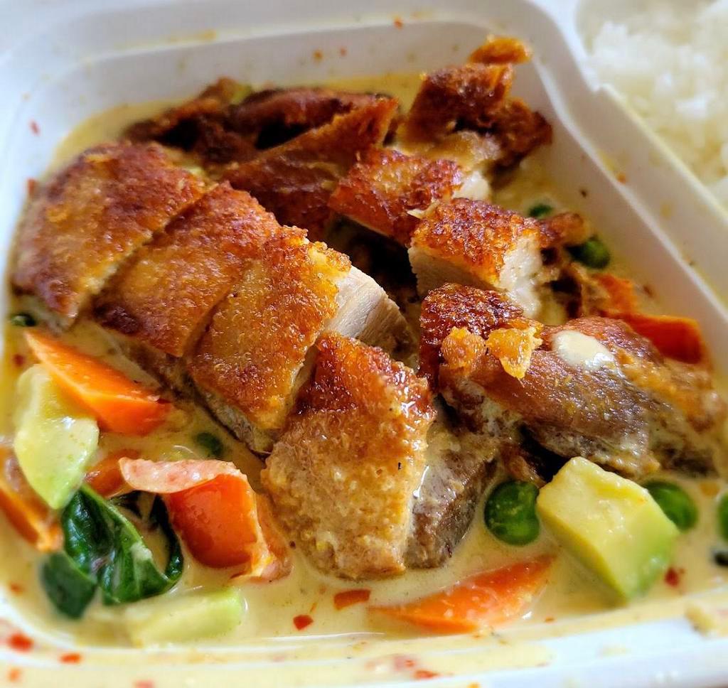 Duck With Avocado Green Curry · Half crispy boneless duck on green curry with avocado, carrot, bell peppers, green peas and basil