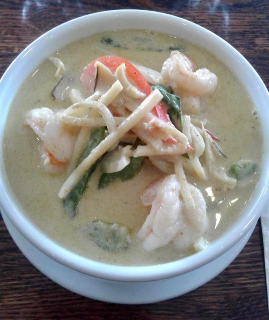 47. Gang Kiew Wan (GREEN CURRY) · Green curry and coconut milk with eggplants, bell peppers, onions, bamboo shoots, lime leaves and basil leaves. Spicy.