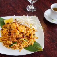 58. Pad Thai · Stir fried thin Thai rice noodles with egg, crushed peanuts chopped turnips, tofu, scallions...