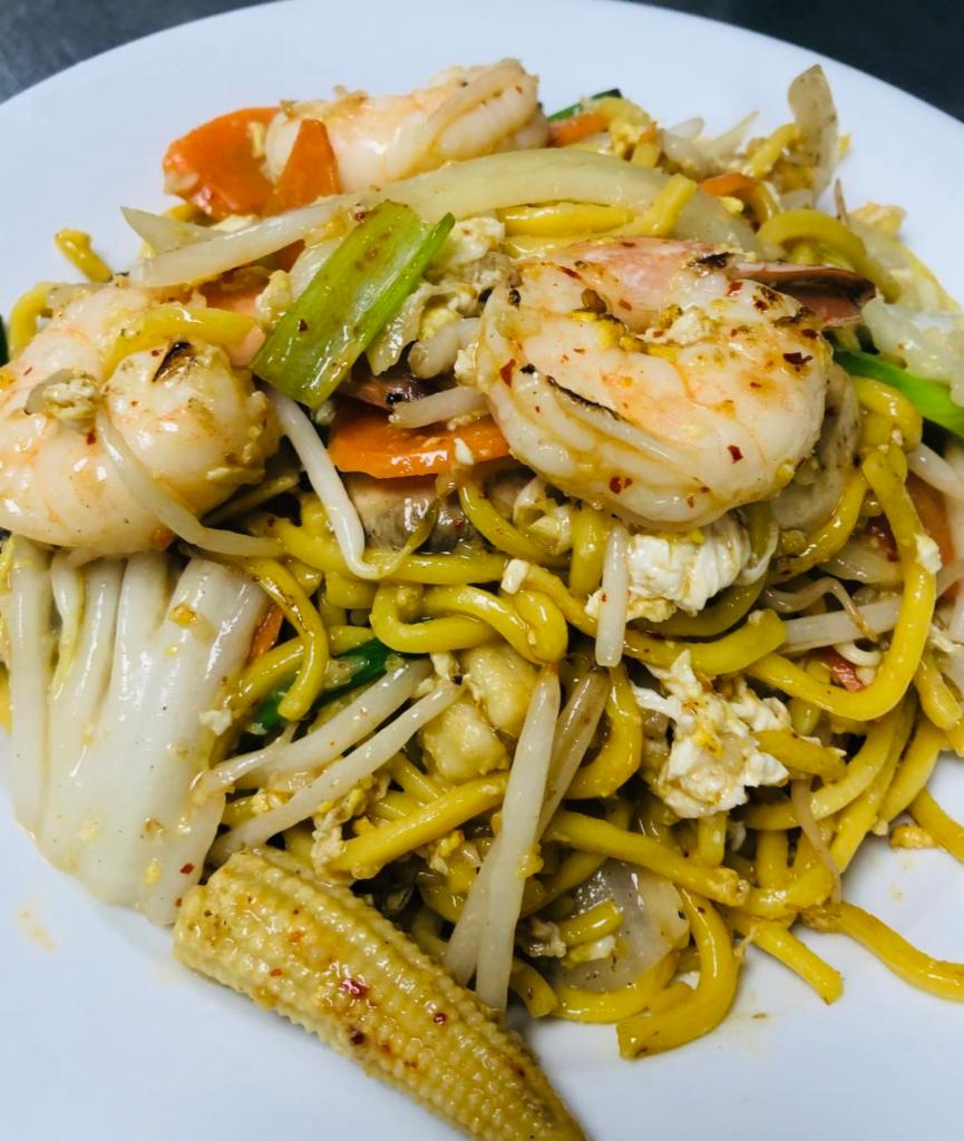 62. Pad Ba-Mee · Stir fried egg noodles with bean sprouts, baby corns, onions mushrooms, Napa, carrots and scallions.