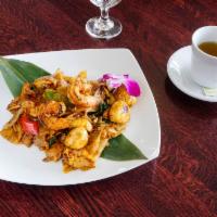 65. Pad Kee Mao(Drunken Noodle) · Stir fried broad rice noodles with eggs, shrimp & chicken, basil leaves, onions, mushrooms, ...