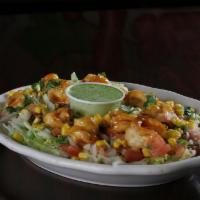 Peruvian Shrimp Salad · Grilled shrimp sautéed with Peruvian sauce served on a bed of rice and lettuce, corn, pico d...