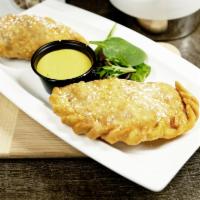 Chicken Empanada (02 Units) · Deep fried Empanada filled with chopped chicken, onions, tomatoes and egg.