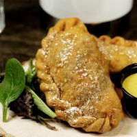 Beef Empanada (02 Units) · Deep fried Empanada filled with chopped meat, onios, tomatoes, olive and raisins.