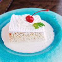 Tres Leches · Three forms of milk are poured over a baked cake.