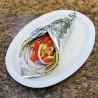 Veggie Souvlaki Pita · Grilled bell pepper and onion with hummus wrapped in a pita with lettuce, tomato, onion and ...